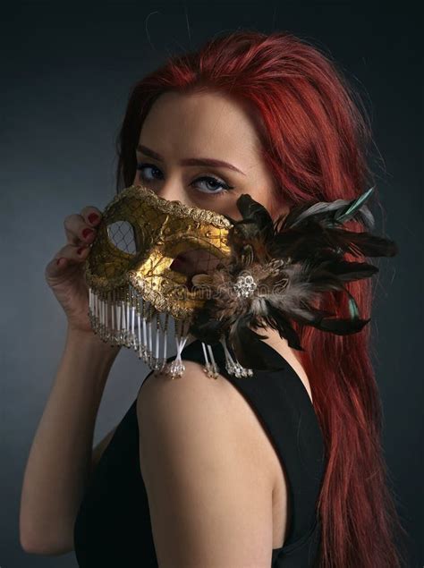 Beautiful Woman With Gold Carnival Mask On Black Background Stock Image