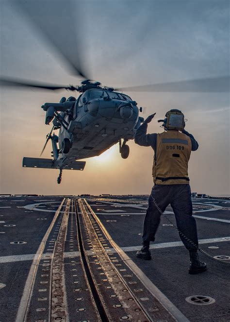 Boatswain S Mate 2nd Class Archangel Smiley Signals An MH 60S Sea Hawk