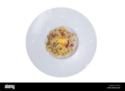 Pasta Carbonara With Parmesan Egg Yolk And Bacon Top View Isolated