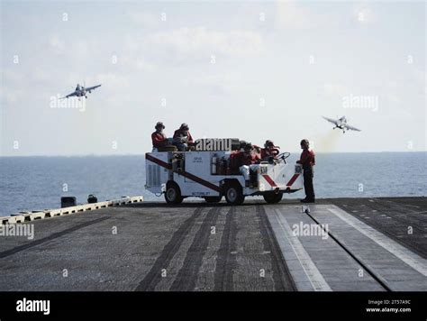 Us Navy Sailors Stand Flight Deck Fire Watch As An F C Hornet Assigned