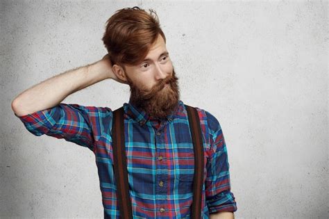 Free Photo Portrait Of Confused Young Woman Scratching Head