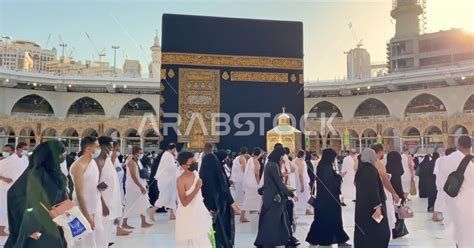 Pilgrims circumambulating the Kaaba in the Grand Mosque in Mecca ...