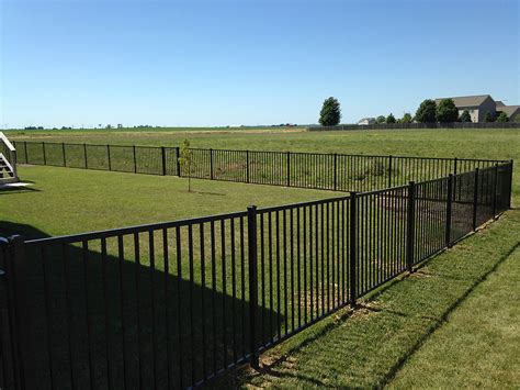 black-aluminum-fence-installation-in-normal-il – Carlson Exteriors Inc.