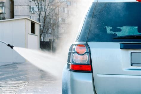 Premium Photo | Car washing with pressure washer