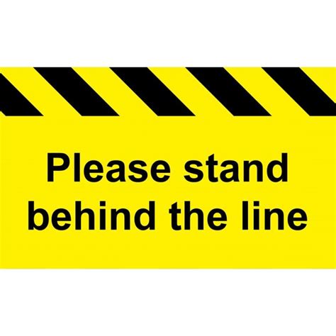 A Yellow And Black Sign That Says Please Stand Behind The Line