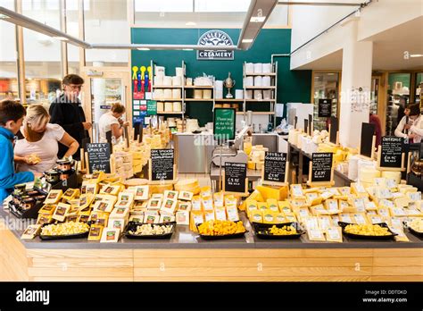 People tasting cheese in The cheese shop in the Wensleydale Creamery ...