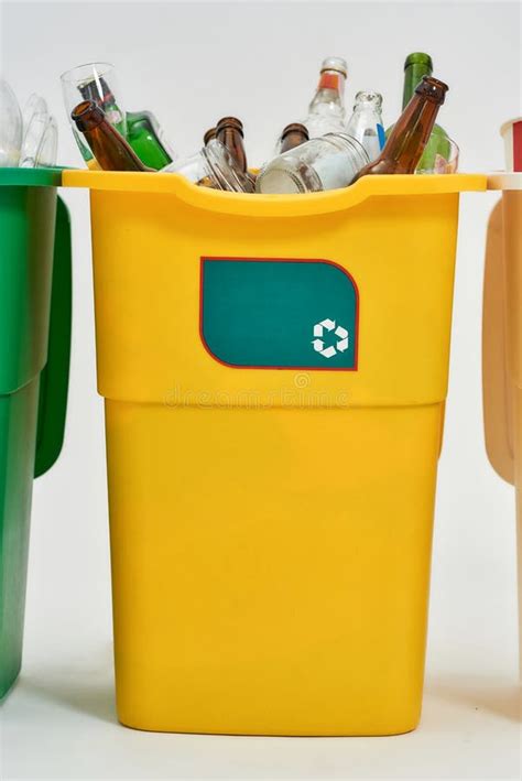 Yellow Recycle Garbage Bin With Recycle Sign On It Full Of Rubbish