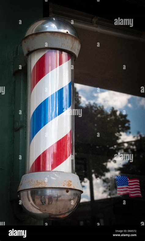 Iconic barber shop pole sign Stock Photo - Alamy