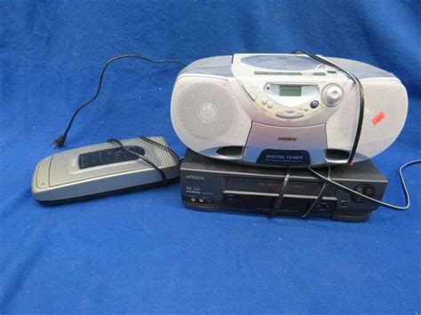 Phillips CD player, Hitachi VHS player, and a Dynex VHS rewinder. All ...