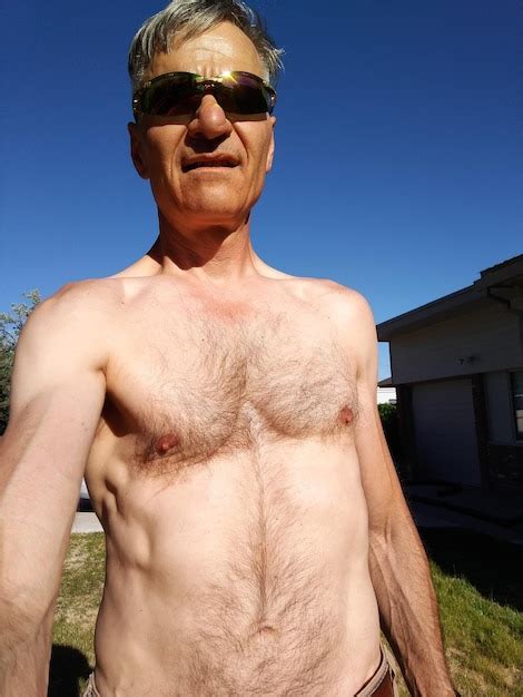 Premium Photo Portrait Of Shirtless Mature Man Wearing Sunglasses