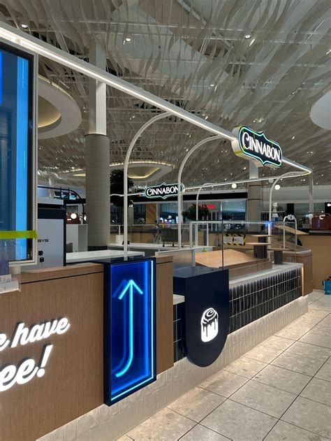 custom kiosk design inspiration walnut coffee tone cinnabon kiosk