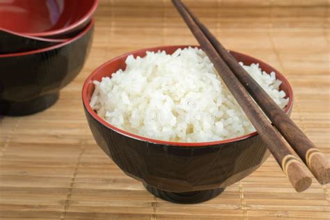 White Steamed Rice In A Bowl With Chopsticks Royalty Free Stock Photo