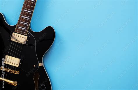 Electric guitar on a blue background Stock Photo | Adobe Stock