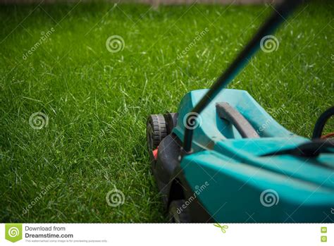 Mowing And Cutting The Long Grass With A Lawn Mower Closeup Stock Image Image Of Trim