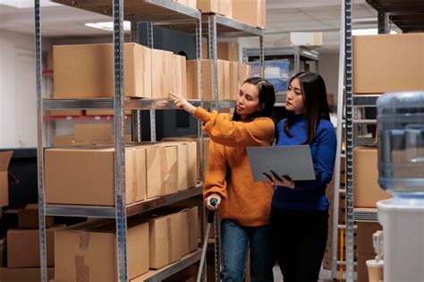 Premium Photo Warehouse Workers Choosing Cardboard Box To Prepare