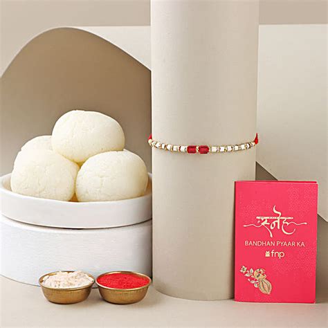 Sneh White And Red Bead Rakhi With Rasgulla Singapore Gift Sneh White