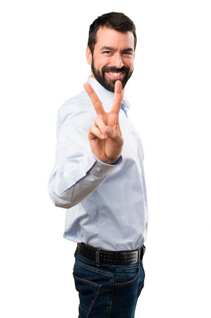 Premium Photo Handsome Man With Beard Making Victory Gesture