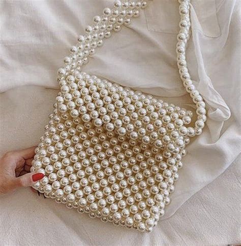 Pin by Magygamal on شنط لولي Beaded bags Pearl bag Beaded handbag