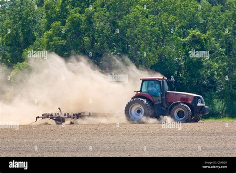 Tractor In Dry Dusty Farm Field Stock Photo Alamy