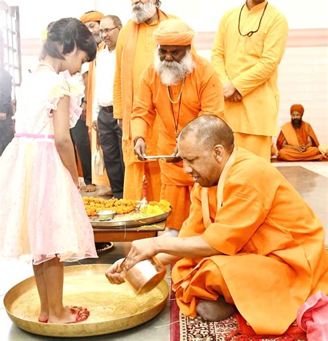 Gorakhpur Uttar Pradesh Cm Yogi Adityanath Performs Rituals To A Young Girl