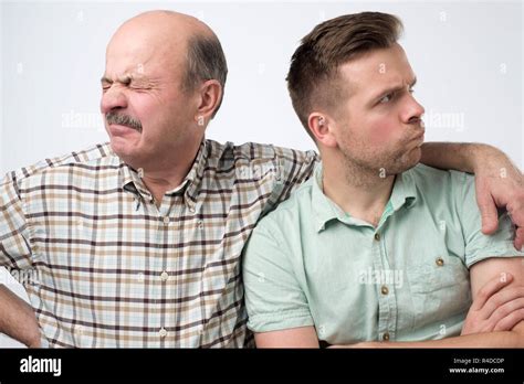 Two Mature Men Father And Son Are Offended On Each Other Have A