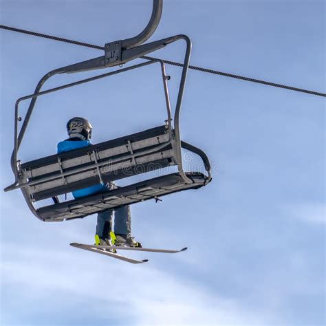 Skier On A Chair Lift Against Beautiful Blue Sky Stock Image Image Of