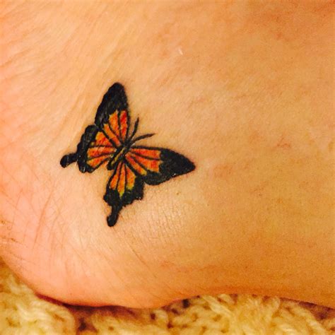 Small Simple Monarch Butterfly Tattoo On Lower Ankle