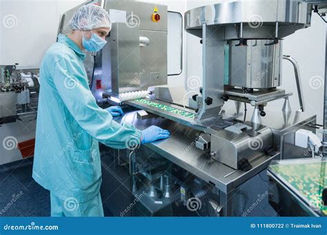 Pharmaceutical Industry Man Worker In Protective Clothing Operating