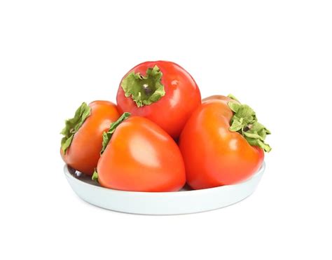 Premium Photo Plate With Delicious Fresh Persimmons Isolated On White