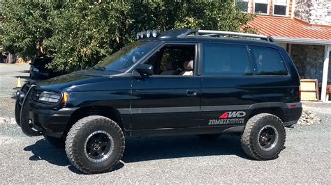 Mazda MPV 4WD | Black SUV Parked in Front of a House