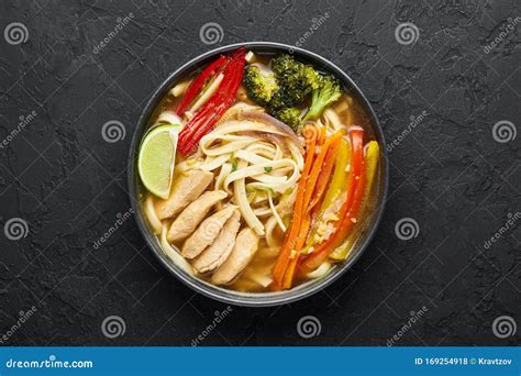 Chicken Thukpa in Black Bowl at Dark Slate Background. Chicken Thukpa is Tibetan Cuisine Noodle ...