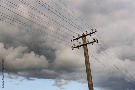 Storm cloud formation above electrical power line Stock Photo | Adobe Stock