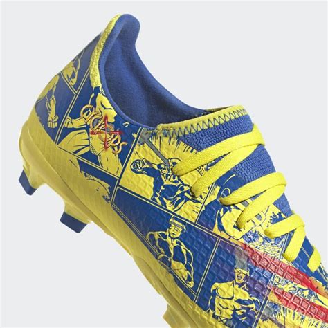 A Pair Of Yellow And Blue Soccer Shoes