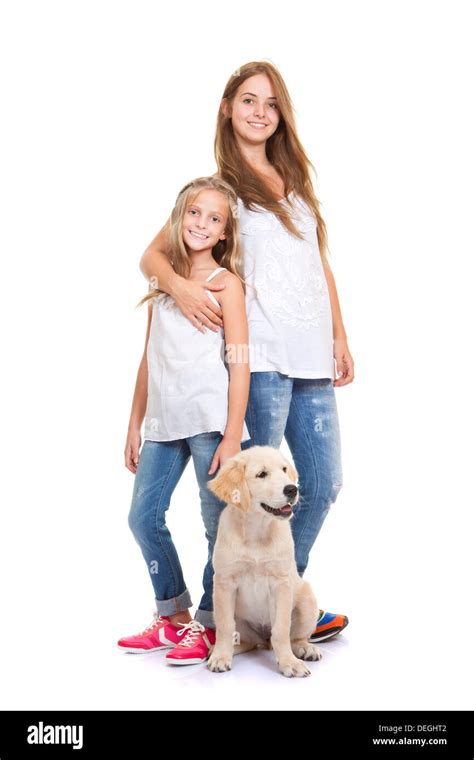 kids with golden labrador, retriever puppy Stock Photo - Alamy