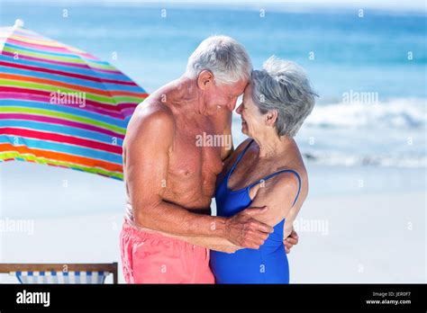 Cute Mature Couple Hugging On The Beach Stock Photo Alamy