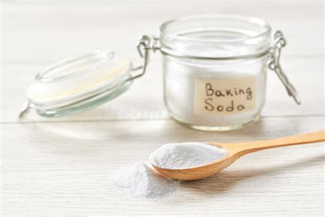 Jar Of Baking Soda On A Light Wooden Table Environmentally Friendly