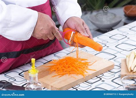 Chef Slicing Carrots With Peeler Stock Image Image Of Professional