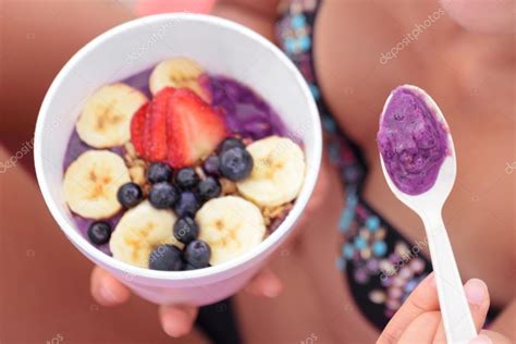 Person Eating Acai Bowl — Stock Photo © Maridav 97349846