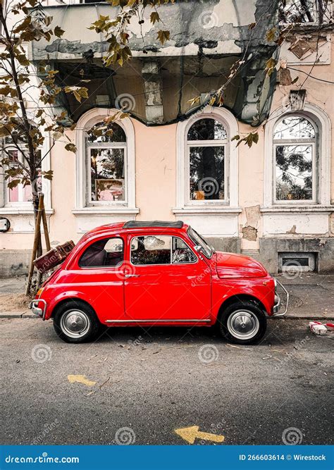 Vertical Shot Of An Old Red Fiat 500 Parked On The Street Editorial