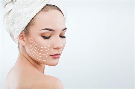 Premium Photo Pretty Girl With Dark Eyebrows And Naked Shoulders Wearing White Towel On Head