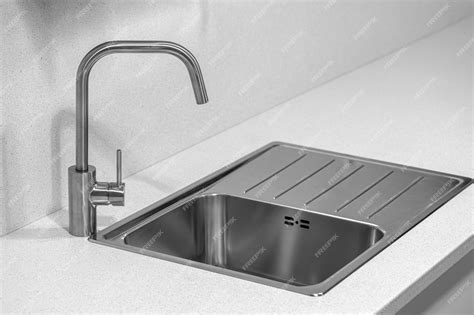 Premium Photo | Kitchen sink with stainless steel faucet sink