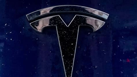 tesla logo  iconic symbol  innovation wallpaper