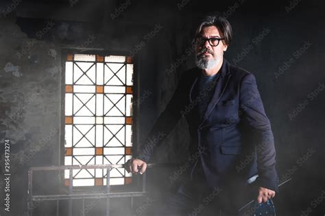 Portrait Of Mature Handsome Male Model Who Posing In Old Abbandoned