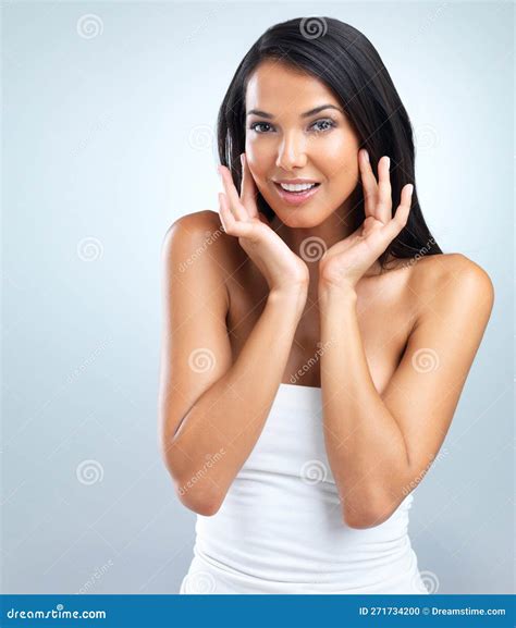 Silky Soft Skin Cropped Studio Shot Of A Beautiful Young Woman Against