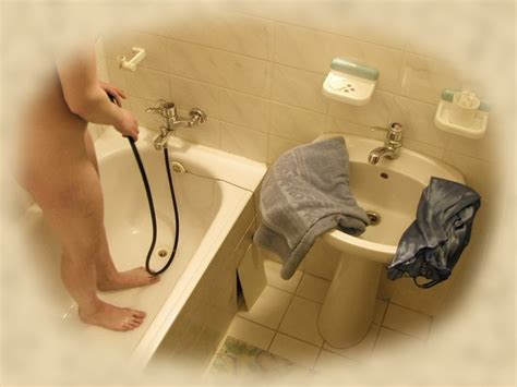 Spy Cam Shots Of Unsuspecting Babe Caught Taking A Shower Porn Pictures