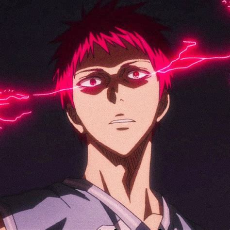 A Man With Pink Hair And Red Eyes Stares At The Camera In Front Of Neon