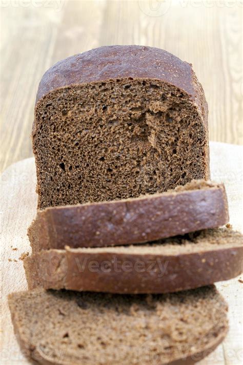 Sliced loaf of rye bread 9773751 Stock Photo at Vecteezy