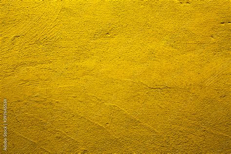 Yellow colored abstract wall background with textures of different ...