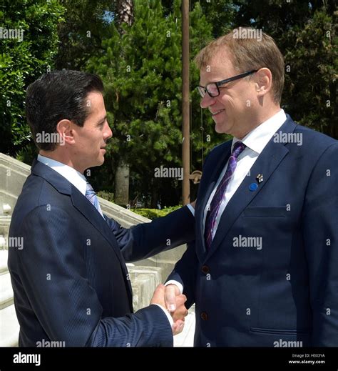 Mexican President Enrique Pena Nieto greets Finnish Prime Minister Juha ...