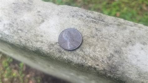 Why Are Coins Left On Military Tombstones Theres A Meaning